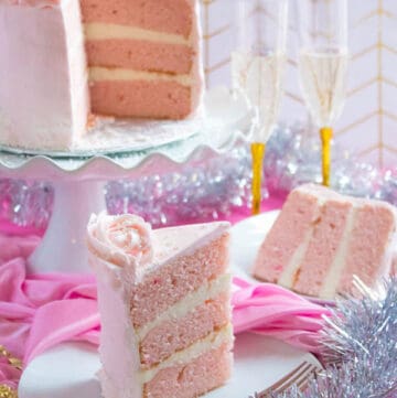 This Pink Champagne Cake is the perfect way to celebrate New Years Eve. Layers of Champagne infused cake, filled with a Champagne infused Buttercream and frosted with a light and fluffy vanilla buttercream — there's no better way to start the new year!