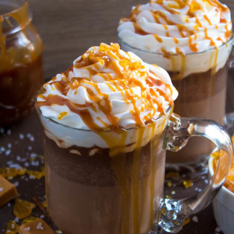 Salted Caramel Hot Chocolate - sweet and salty caramel hot chocolate, topped with sweetened whipped cream, salted caramel sauce and homemade salted caramel sugar! This is the perfect drink for warming up during the cold winter months.