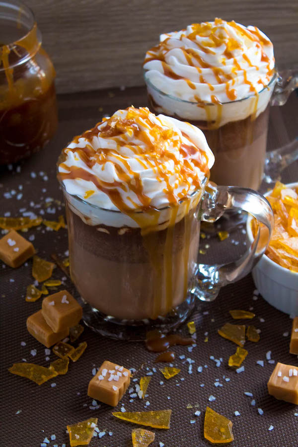 Salted Caramel Hot Chocolate - sweet and salty caramel hot chocolate, topped with sweetened whipped cream, salted caramel sauce and homemade salted caramel sugar! This is the perfect drink for warming up during the cold winter months.