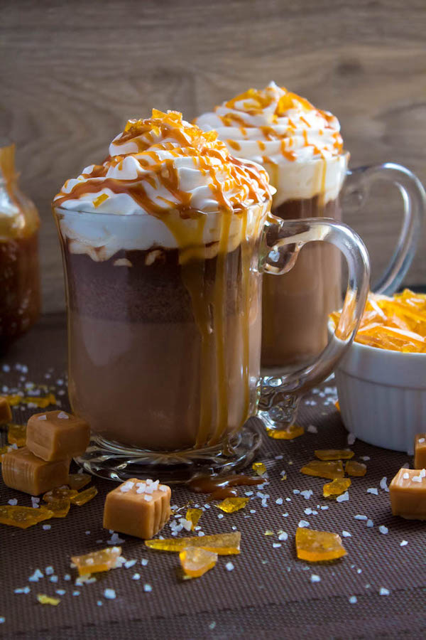 Salted Caramel Hot Chocolate - sweet and salty caramel hot chocolate, topped with sweetened whipped cream, salted caramel sauce and homemade salted caramel sugar! This is the perfect drink for warming up during the cold winter months.