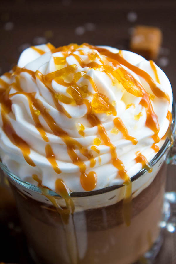 Salted Caramel Hot Chocolate - sweet and salty caramel hot chocolate, topped with sweetened whipped cream, salted caramel sauce and homemade salted caramel sugar! This is the perfect drink for warming up during the cold winter months.