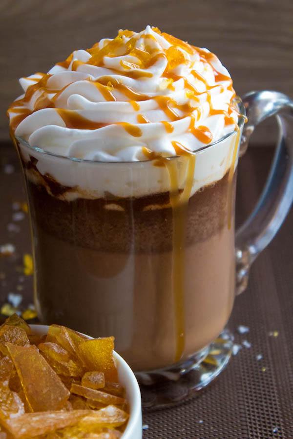 Salted Caramel Hot Chocolate - sweet and salty caramel hot chocolate, topped with sweetened whipped cream, salted caramel sauce and homemade salted caramel sugar! This is the perfect drink for warming up during the cold winter months.