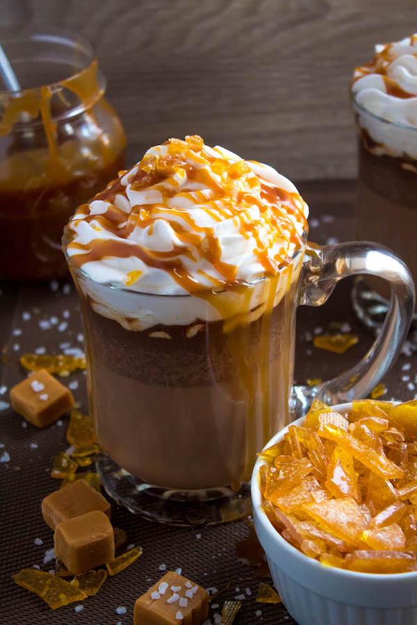 Salted Caramel Hot Chocolate - sweet and salty caramel hot chocolate, topped with sweetened whipped cream, salted caramel sauce and homemade salted caramel sugar! This is the perfect drink for warming up during the cold winter months.