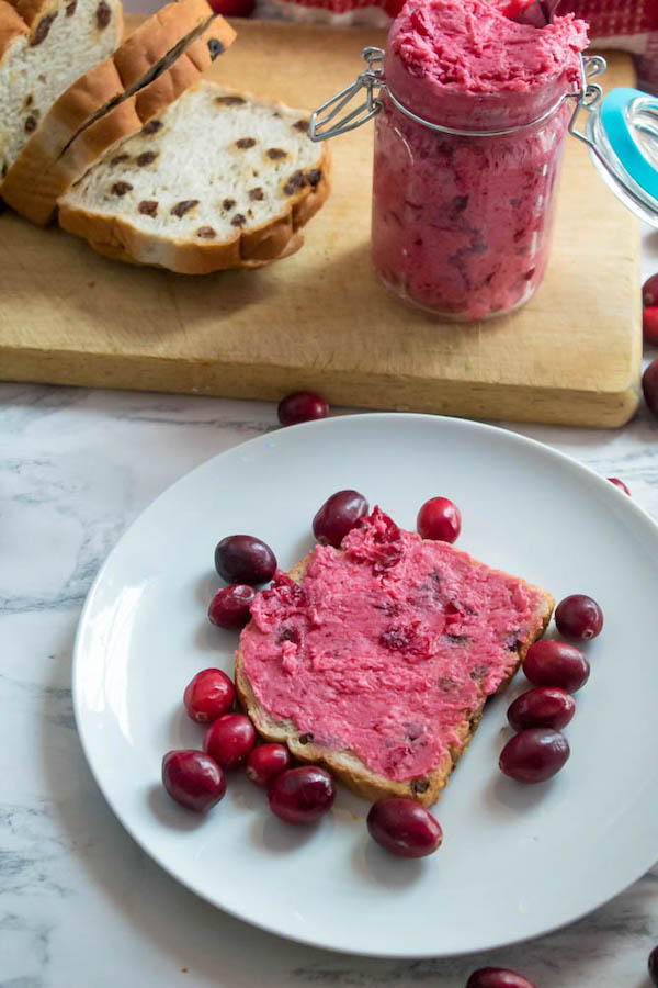 This Whipped Cranberry Honey Butter is sweet, tart, fruity and simple to make. It's perfect on toast, raisin bread, scones, dinner rolls, bagels and so much more!