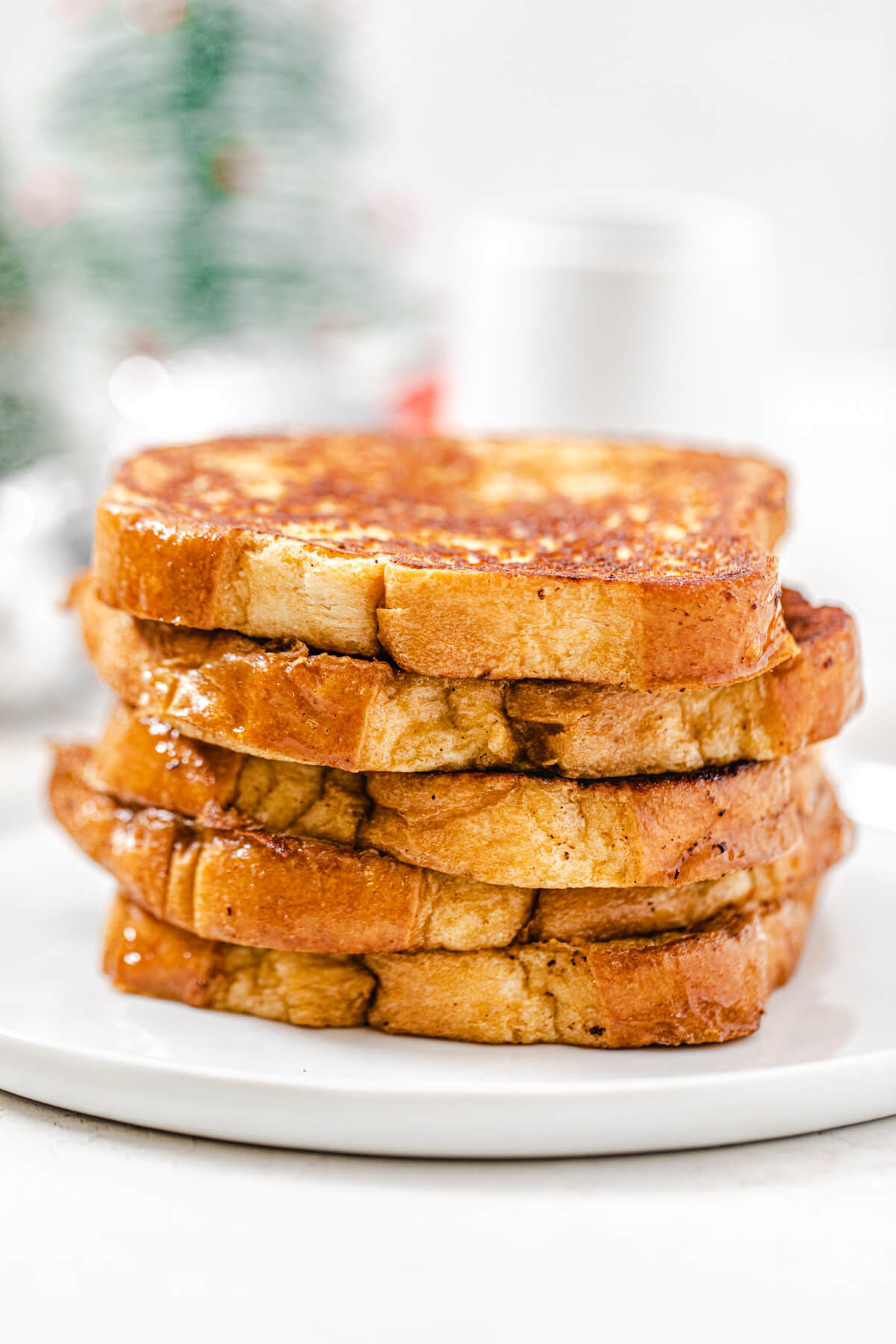 stack of French toast on a white plate