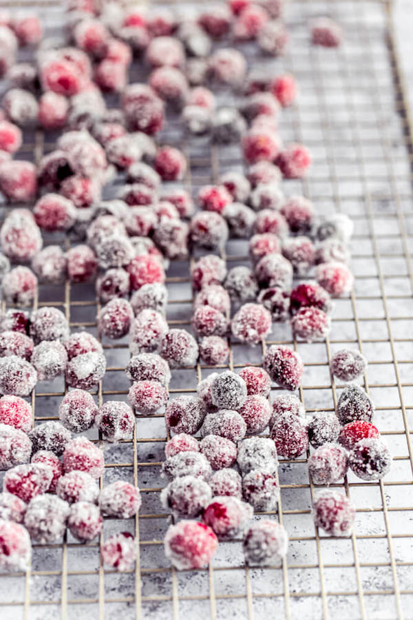 sugared cranberries on a wire rack
