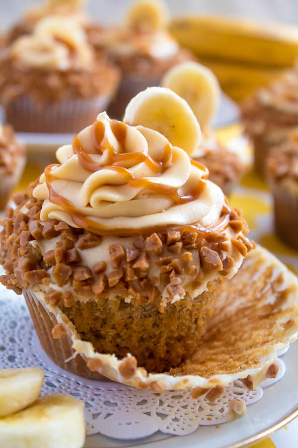 These Banana Caramel Cupcakes are moist, fluffy, tender and have the most perfect banana flavour! Filled with homemade caramel sauce, rolled in toffee bits and topped with Caramel Cream Cheese Frosting — these cupcakes will have your taste buds going crazy!