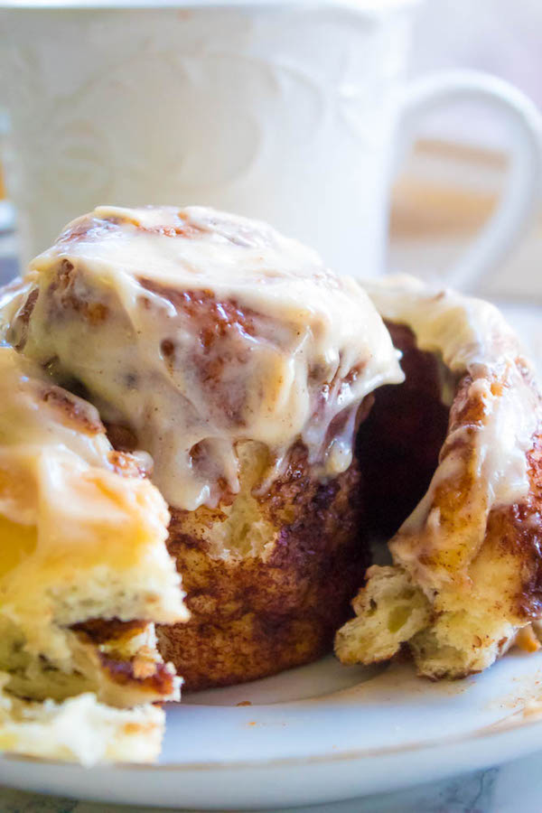 These are hands down the best Cinnamon Rolls I've ever had! They're incredibly soft, fluffy, warm and gooey. Smothered in a silky smooth Cinnamon Cream Cheese Icing, this will undoubtedly be your new favourite cinnamon roll recipe!