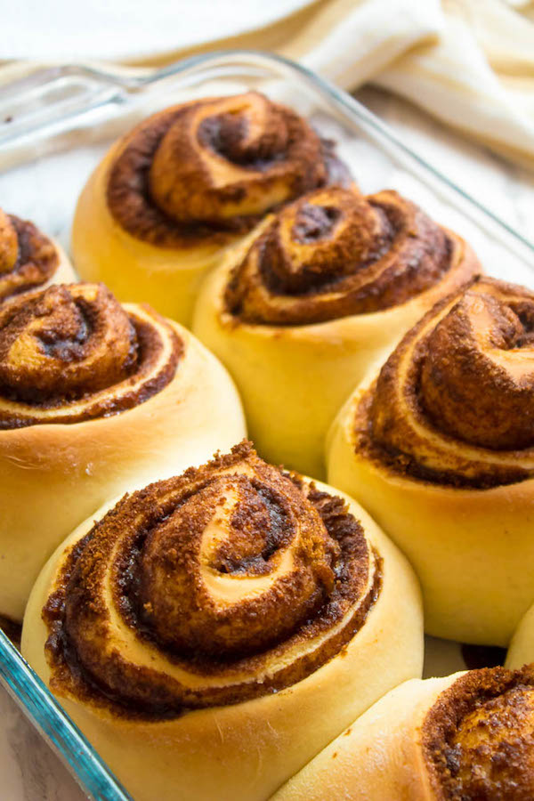 These are hands down the best Cinnamon Rolls I've ever had! They're incredibly soft, fluffy, warm and gooey. Smothered in a silky smooth Cinnamon Cream Cheese Icing, this will undoubtedly be your new favourite cinnamon roll recipe!
