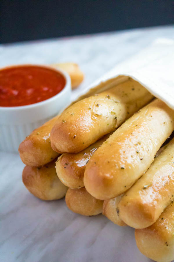 These Homemade Garlic Butter Breadsticks are incredibly soft, fluffy and buttery. They're so simple to make and are a great addition to all your meals!