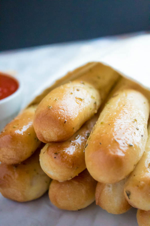 These Homemade Garlic Butter Breadsticks are incredibly soft, fluffy and buttery. They're so simple to make and are a great addition to all your meals!