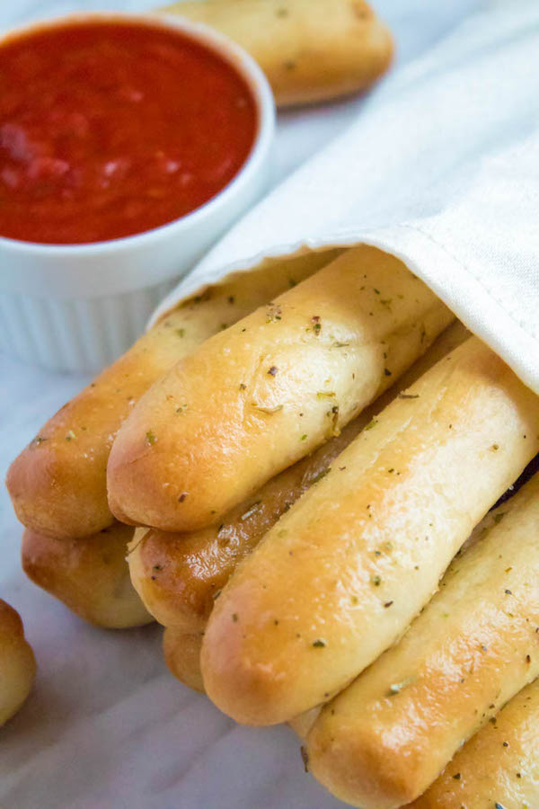 These Homemade Garlic Butter Breadsticks are incredibly soft, fluffy and buttery. They're so simple to make and are a great addition to all your meals!