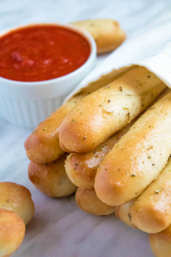 These Homemade Garlic Butter Breadsticks are incredibly soft, fluffy and buttery. They're so simple to make and are a great addition to all your meals!