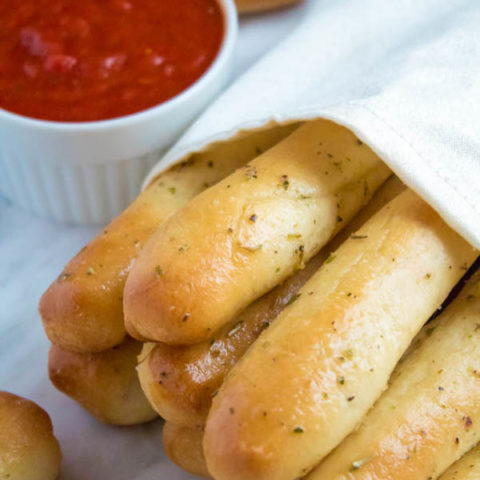 These Homemade Garlic Butter Breadsticks are incredibly soft, fluffy and buttery. They're so simple to make and are a great addition to all your meals!