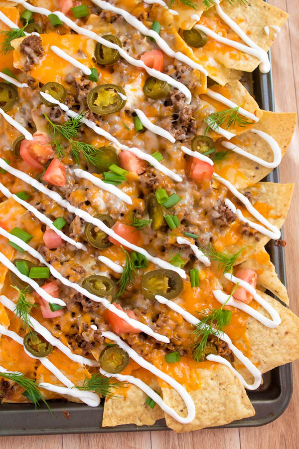 These tasty Nachos are loaded with taco-seasoned ground beef, jalapeños, 2 different cheeses and so much more! Serve them at your Superbowl party, movie night, or any occasion!