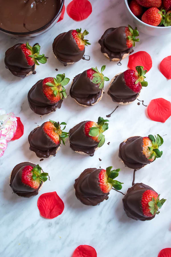 These Mini Chocolate Covered Strawberry Cheesecakes are made with a creamy bite-sized strawberry cheesecake and juicy chocolate covered strawberries. These are the perfect treats to finish off a romantic Valentine's Day dinner!