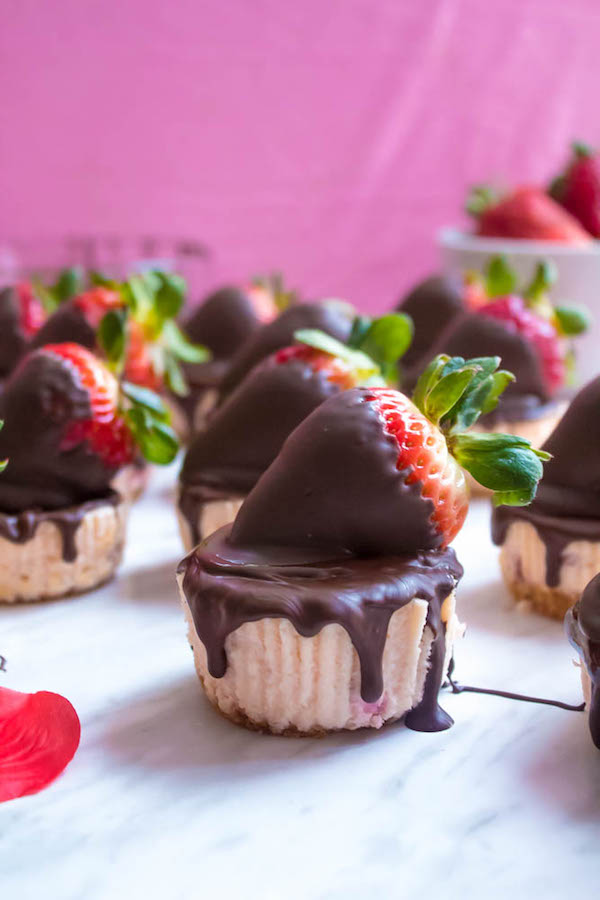 These Mini Chocolate Covered Strawberry Cheesecakes are made with a creamy bite-sized strawberry cheesecake and juicy chocolate covered strawberries. These are the perfect treats to finish off a romantic Valentine's Day dinner!