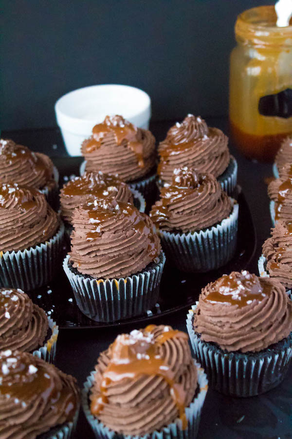 These Salted Caramel Dark Chocolate Cupcakes are made with a moist Dark Chocolate Cake, filled with Salted Caramel Sauce, topped with a rich and decadent Dark Chocolate Buttercream and a sprinkle of sea salt. They're simply irresistible!