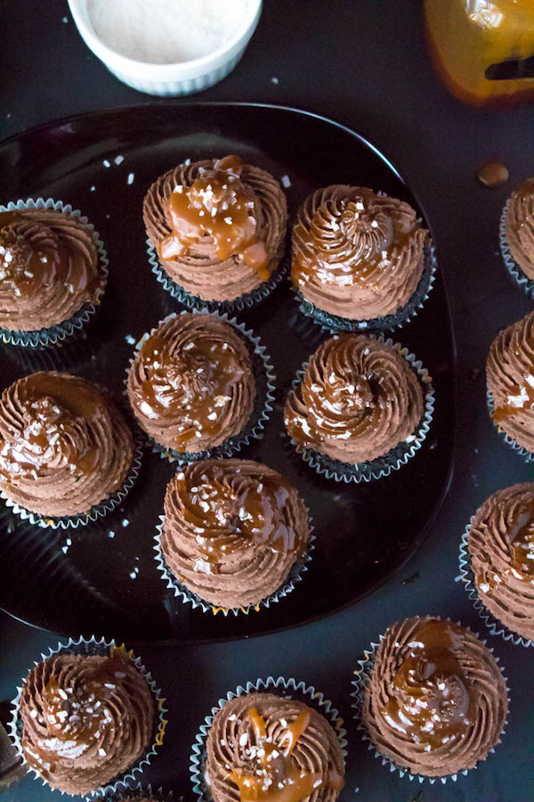 These Salted Caramel Dark Chocolate Cupcakes are made with a moist Dark Chocolate Cake, filled with Salted Caramel Sauce, topped with a rich and decadent Dark Chocolate Buttercream and a sprinkle of sea salt. They're simply irresistible!