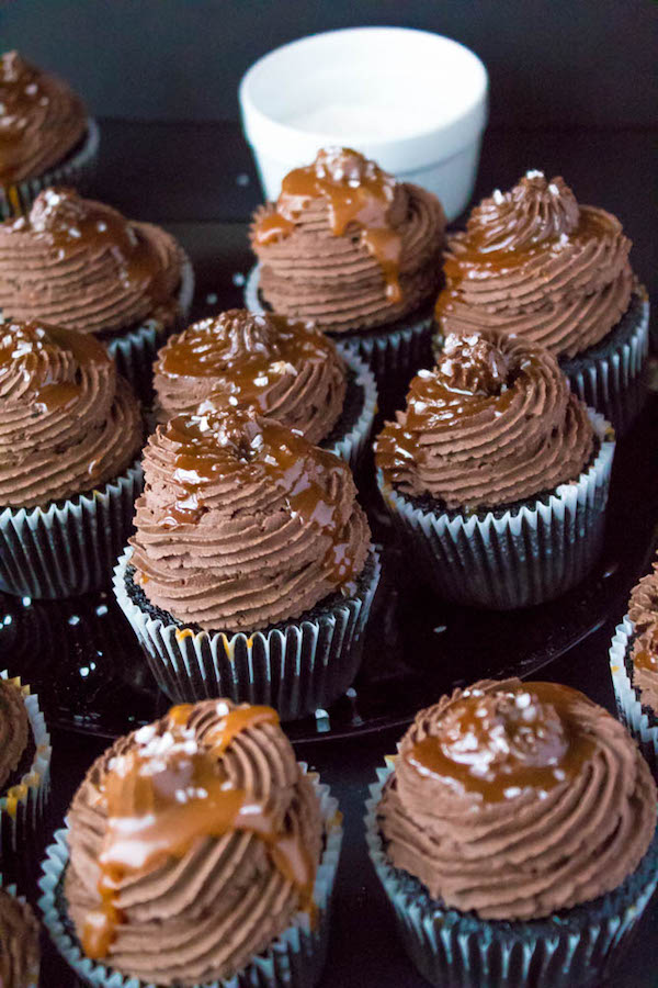 These Salted Caramel Dark Chocolate Cupcakes are made with a moist Dark Chocolate Cake, filled with Salted Caramel Sauce, topped with a rich and decadent Dark Chocolate Buttercream and a sprinkle of sea salt. They're simply irresistible!