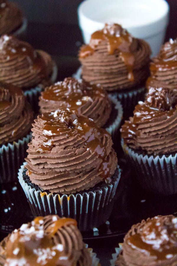 These Salted Caramel Dark Chocolate Cupcakes are made with a moist Dark Chocolate Cake, filled with Salted Caramel Sauce, topped with a rich and decadent Dark Chocolate Buttercream and a sprinkle of sea salt. They're simply irresistible!