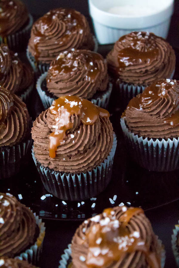 These Salted Caramel Dark Chocolate Cupcakes are made with a moist Dark Chocolate Cake, filled with Salted Caramel Sauce, topped with a rich and decadent Dark Chocolate Buttercream and a sprinkle of sea salt. They're simply irresistible!