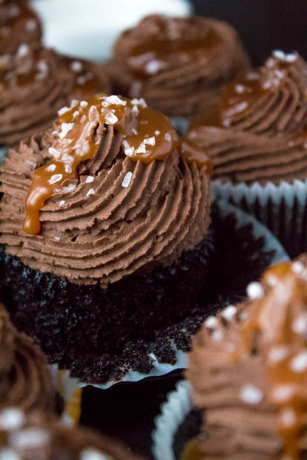 These Salted Caramel Dark Chocolate Cupcakes are made with a moist Dark Chocolate Cake, filled with Salted Caramel Sauce, topped with a rich and decadent Dark Chocolate Buttercream and a sprinkle of sea salt. They're simply irresistible!