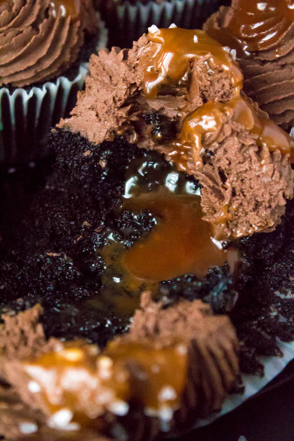 These Salted Caramel Dark Chocolate Cupcakes are made with a moist Dark Chocolate Cake, filled with Salted Caramel Sauce, topped with a rich and decadent Dark Chocolate Buttercream and a sprinkle of sea salt. They're simply irresistible!