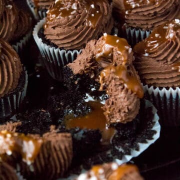 These Salted Caramel Dark Chocolate Cupcakes are made with a moist Dark Chocolate Cake, filled with Salted Caramel Sauce, topped with a rich and decadent Dark Chocolate Buttercream and a sprinkle of sea salt. They're simply irresistible!