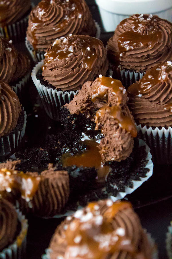 These Salted Caramel Dark Chocolate Cupcakes are made with a moist Dark Chocolate Cake, filled with Salted Caramel Sauce, topped with a rich and decadent Dark Chocolate Buttercream and a sprinkle of sea salt. They're simply irresistible!