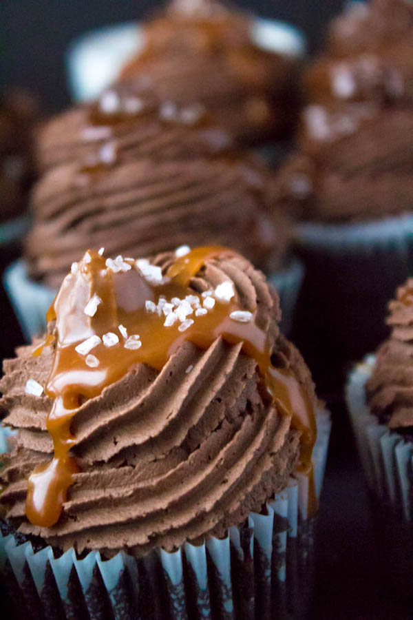 These Salted Caramel Dark Chocolate Cupcakes are made with a moist Dark Chocolate Cake, filled with Salted Caramel Sauce, topped with a rich and decadent Dark Chocolate Buttercream and a sprinkle of sea salt. They're simply irresistible!