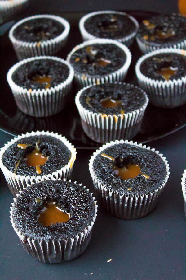 These Salted Caramel Dark Chocolate Cupcakes are made with a moist Dark Chocolate Cake, filled with Salted Caramel Sauce, topped with a rich and decadent Dark Chocolate Buttercream and a sprinkle of sea salt. They're simply irresistible!