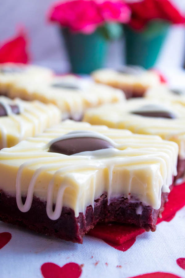 These White Chocolate Fudge Red Velvet Brownies are an upgrade from the classic cake. Rich, fudgy and decadent red velvet brownies, topped with a chewy white chocolate fudge and a drizzle of cream cheese icing for the perfect finishing touch!