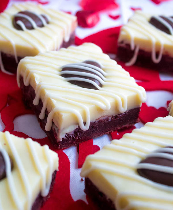 These White Chocolate Fudge Red Velvet Brownies are an upgrade from the classic cake. Rich, fudgy and decadent red velvet brownies, topped with a chewy white chocolate fudge and a drizzle of cream cheese icing for the perfect finishing touch!