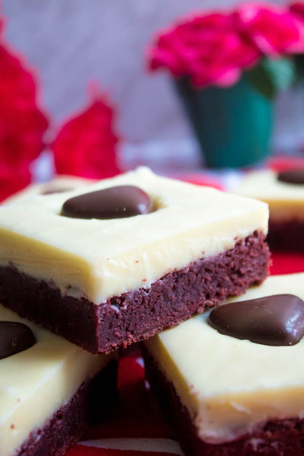 These White Chocolate Fudge Red Velvet Brownies are an upgrade from the classic cake. Rich, fudgy and decadent red velvet brownies, topped with a chewy white chocolate fudge and a drizzle of cream cheese icing for the perfect finishing touch!