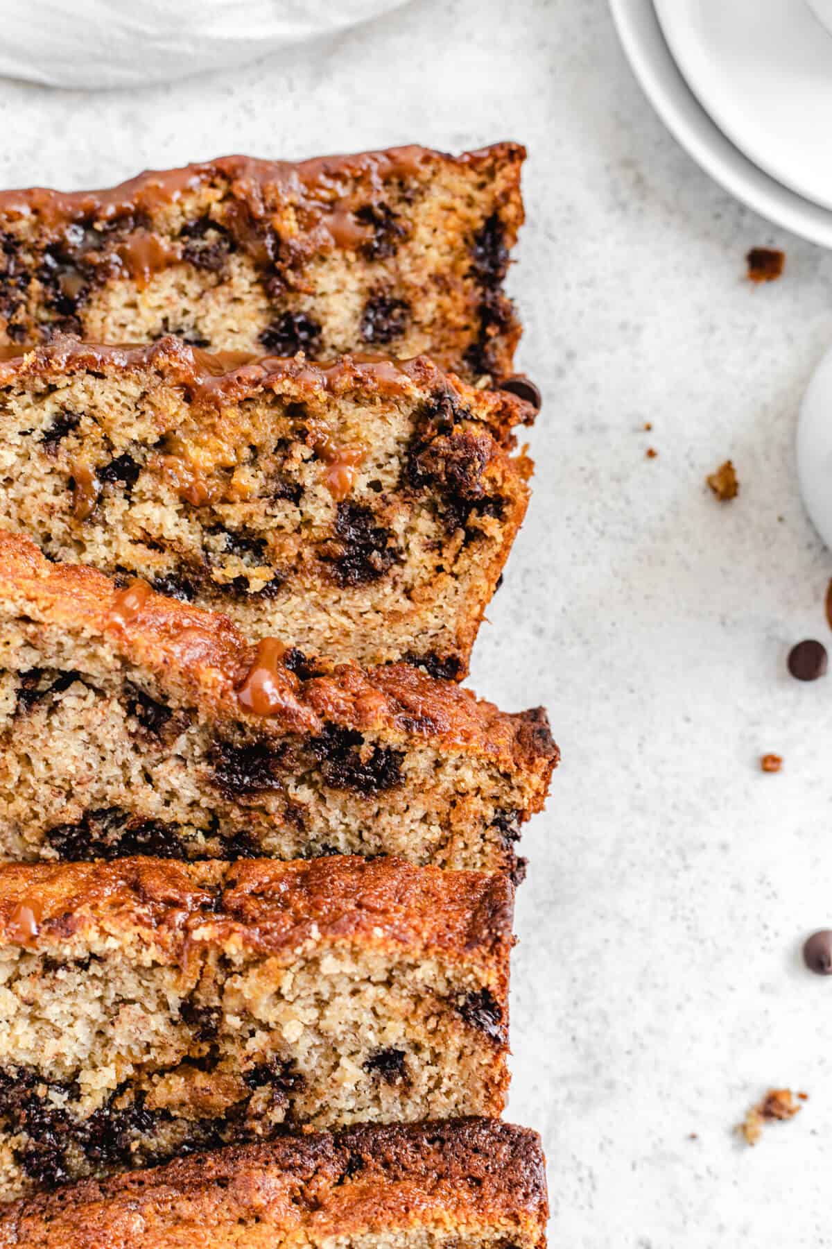 close up of multiple slices of banana bread lined up on each other