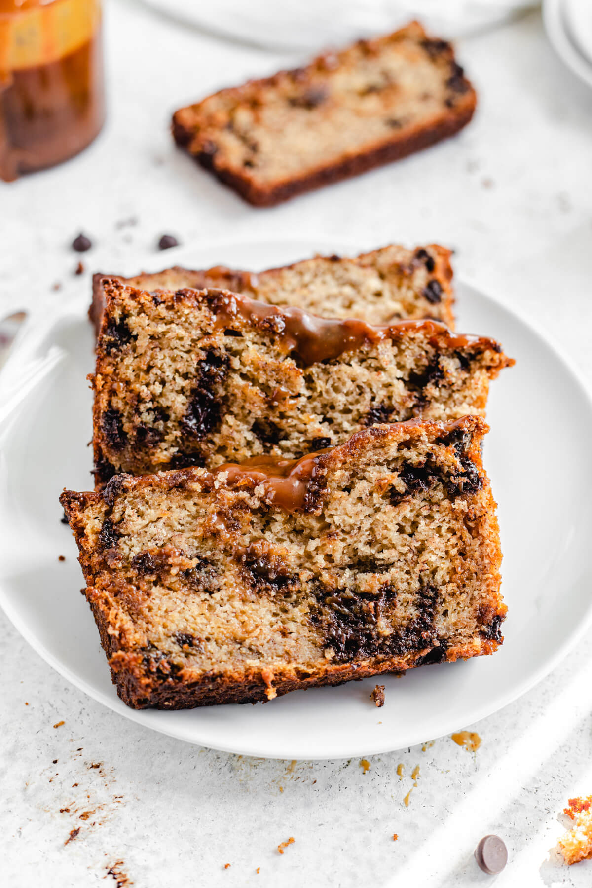 three slices of banana bread on a white plate