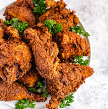 top view of fried chicken and parsley on a platter