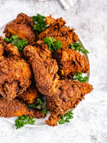 top view of fried chicken and parsley on a platter