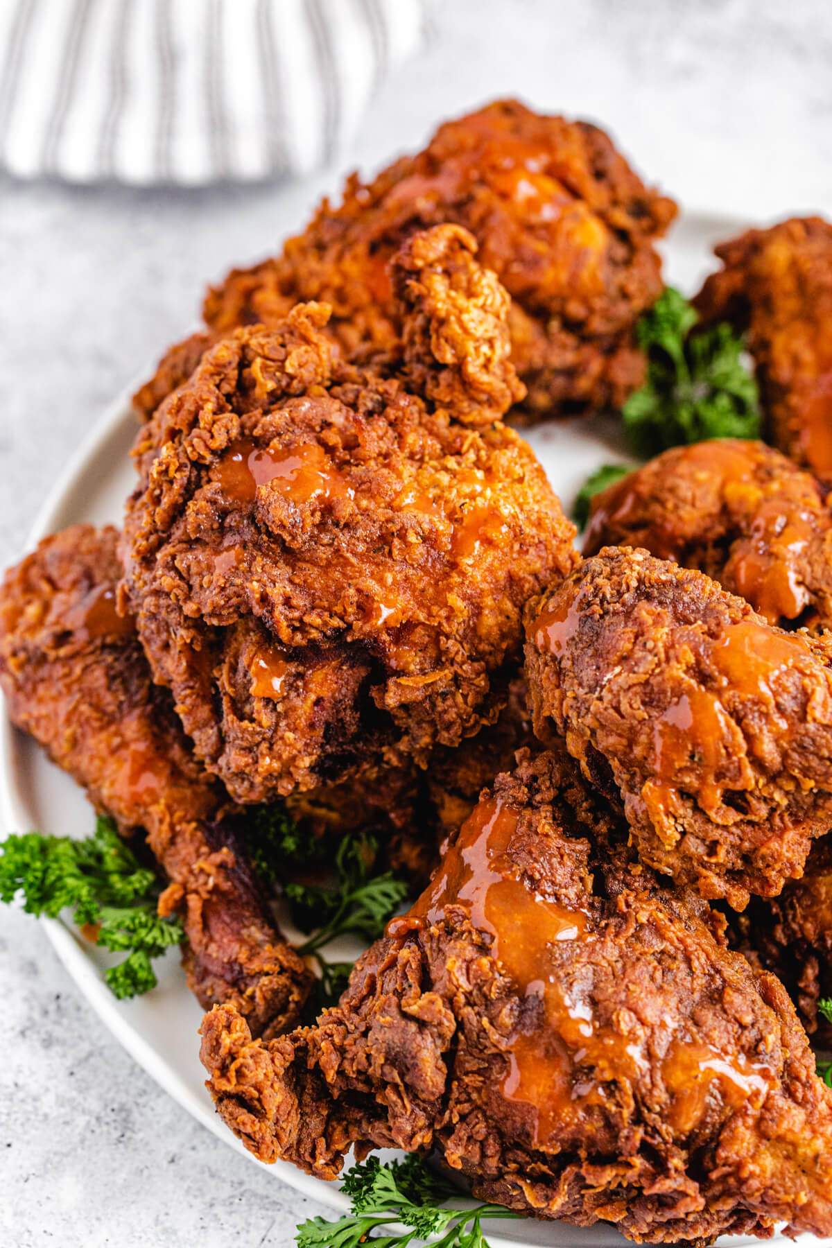 fried chicken with hot sauce on a white plate