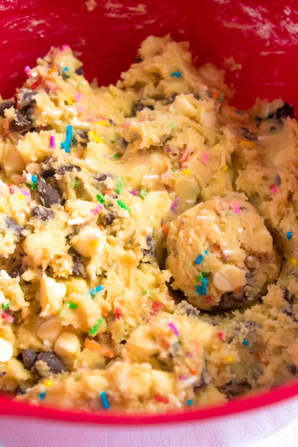 These Funfetti Chocolate Chip Cookies are perfectly soft and chewy. Loaded with two kinds of chocolate chips and rainbow sprinkles — these are the perfect cookies for a celebration!