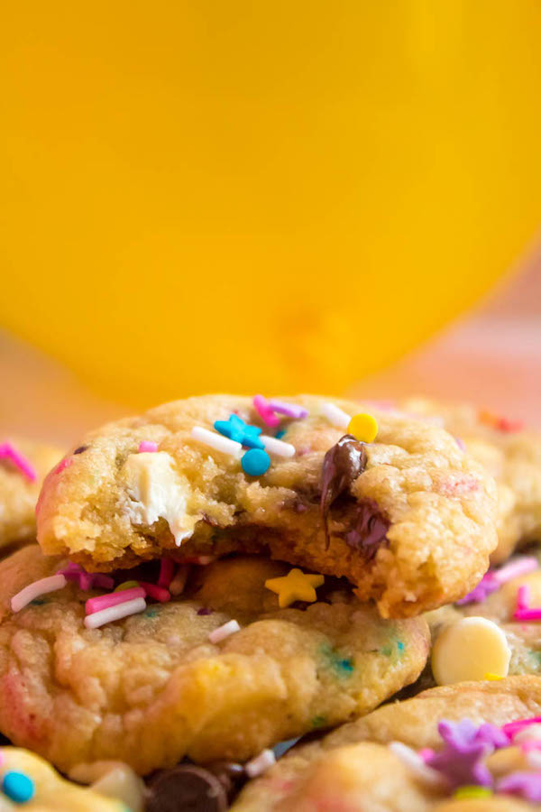 These Funfetti Chocolate Chip Cookies are perfectly soft and chewy. Loaded with two kinds of chocolate chips and rainbow sprinkles — these are the perfect cookies for a celebration!