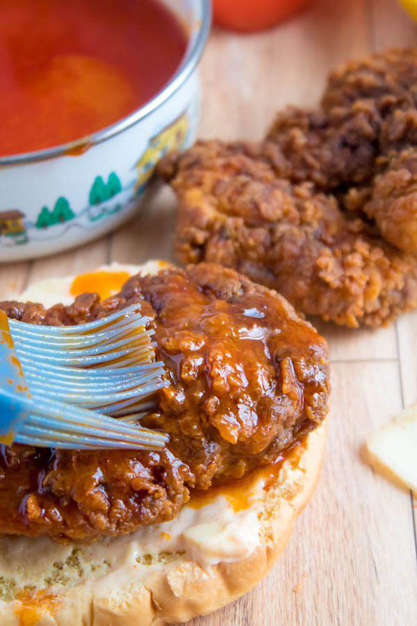 These Spicy Fried Chicken Sandwiches are crispy, juicy and seasoned to perfection. Sandwiched between toasted brioche buns, fresh lettuce, tomatoes, mozzarella, crispy bacon and a flavourful spicy aioli — these fried chicken sandwiches are comfort food at its best!