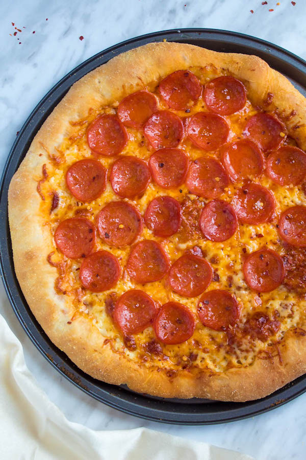 Pizza Night just got a whole lot better! This Homemade Pizza is topped with a flavourful sauce, two types of cheeses and slices of pepperoni. What makes this classic pepperoni pizza so special? The crust is stuffed with cheese!