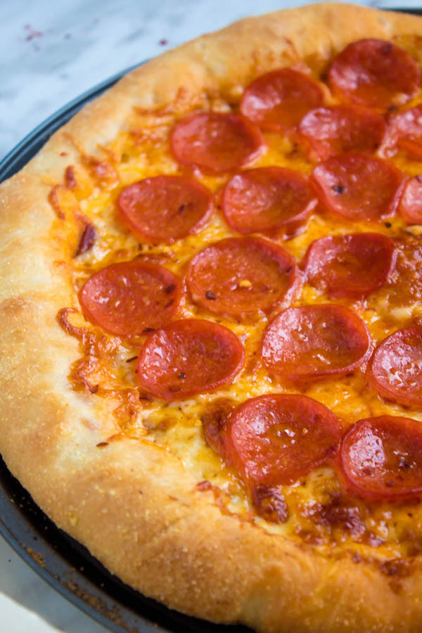 Pizza Night just got a whole lot better! This Homemade Pizza is topped with a flavourful sauce, two types of cheeses and slices of pepperoni. What makes this classic pepperoni pizza so special? The crust is stuffed with cheese!