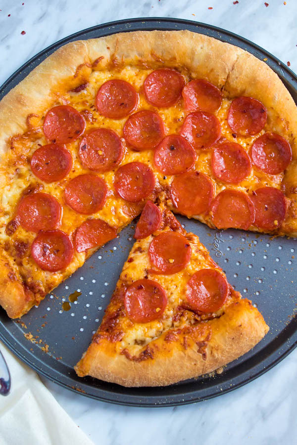 Pizza Night just got a whole lot better! This Homemade Pizza is topped with a flavourful sauce, two types of cheeses and slices of pepperoni. What makes this classic pepperoni pizza so special? The crust is stuffed with cheese!