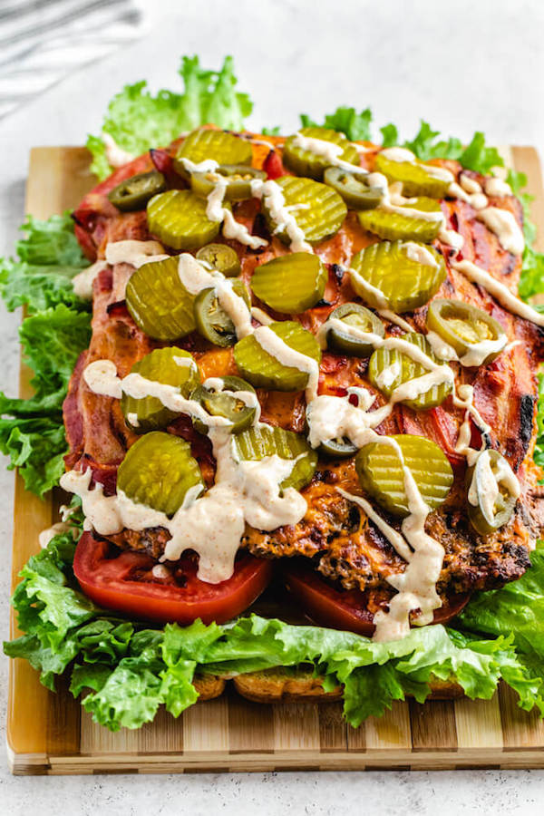 aioli sauce drizzled onto hamburger slider