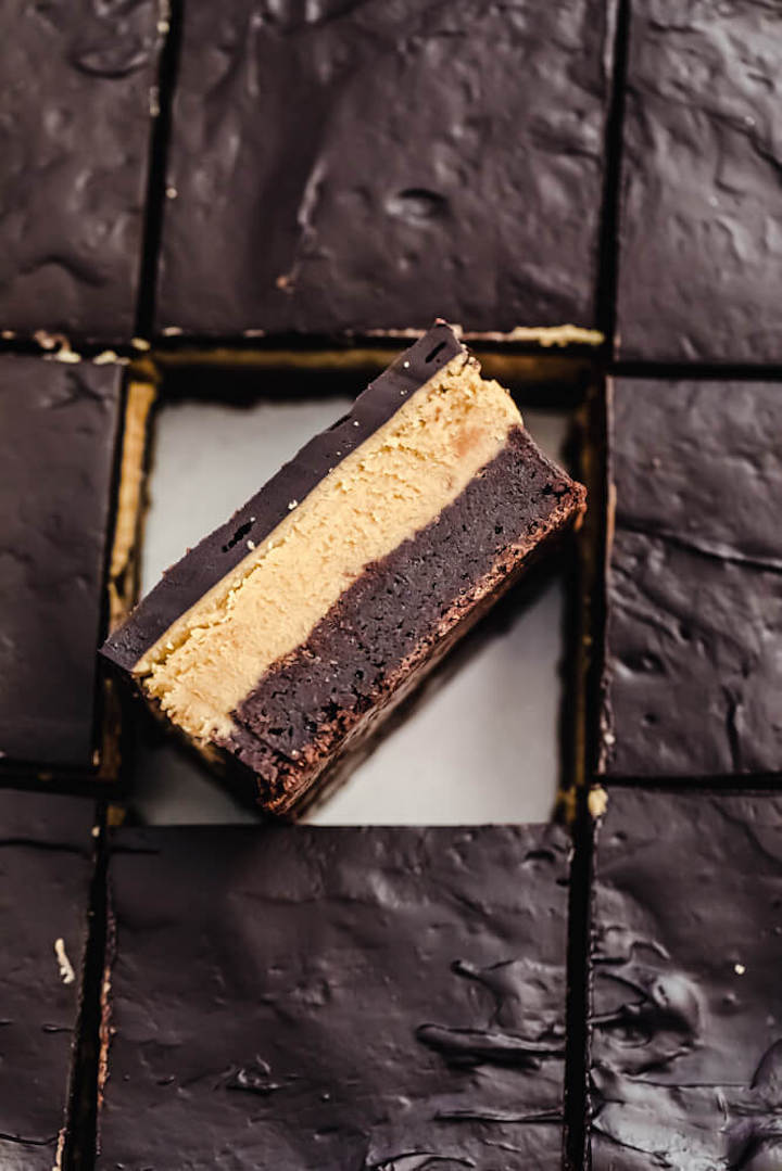 overhead shot of triple layered brownie on its side