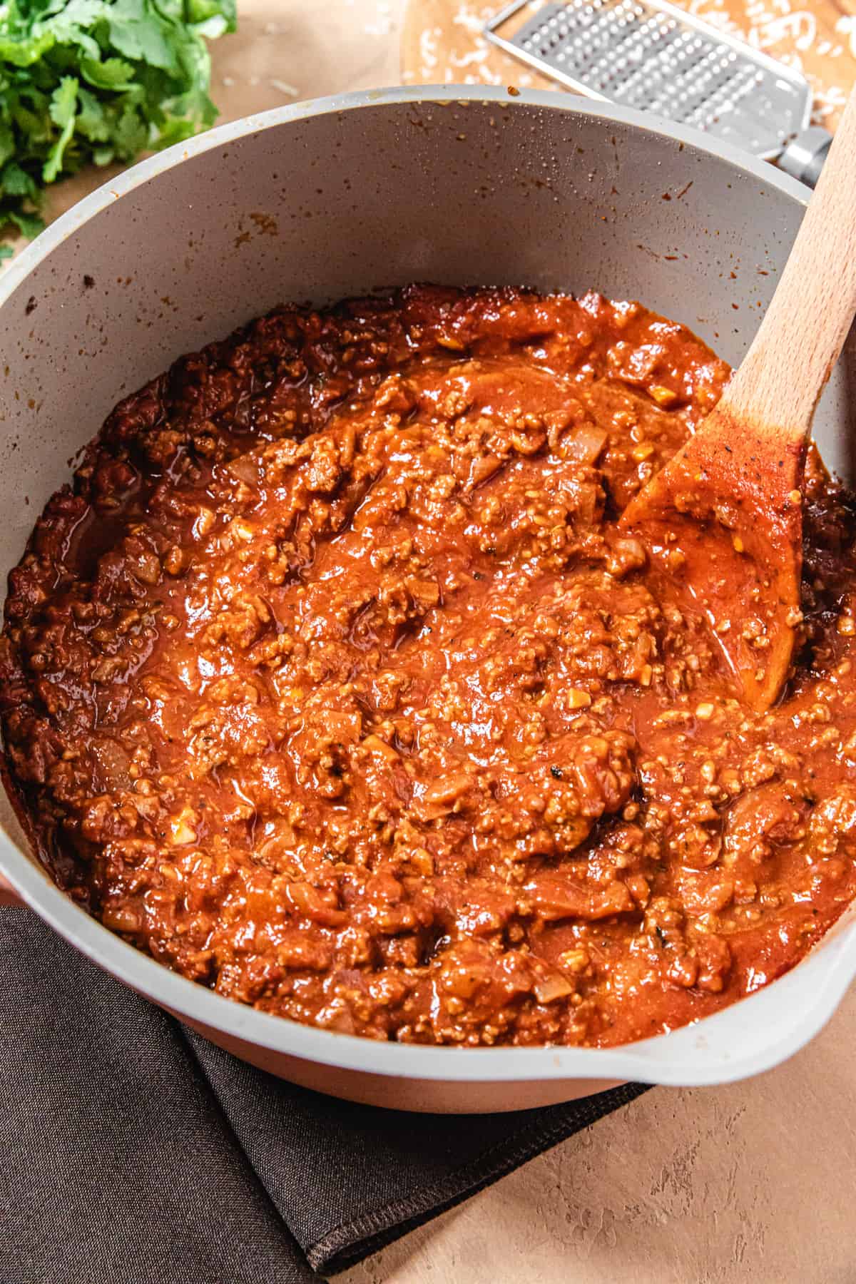 sauce in a pot with a wooden spoon