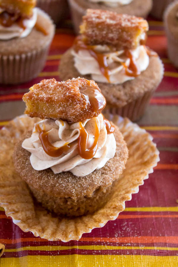 Take your favourite cinnamon/sugar treat and turn it into cupcakes! These Dulce de Leche Churro Cupcakes are a must for Cinco de Mayo! Soft and fluffy cinnamon cupcakes, filled with gooey dulce de leche, dipped in cinnamon sugar, topped with cinnamon buttercream and a dulce de leche filled churro!